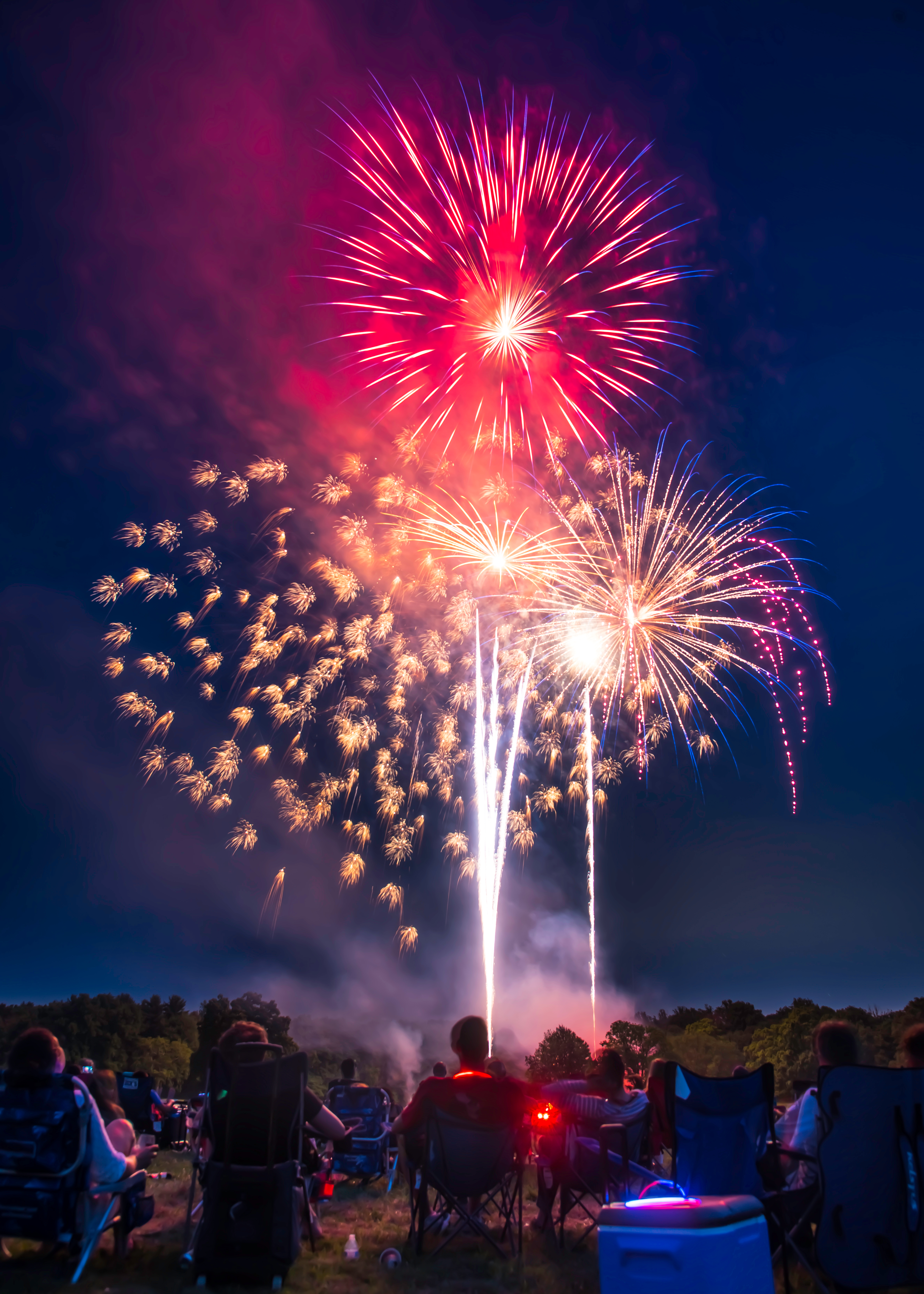 American's,Sitting,In,Lawn,Chair,Watching,Fourth,Of,July,Fireworks.